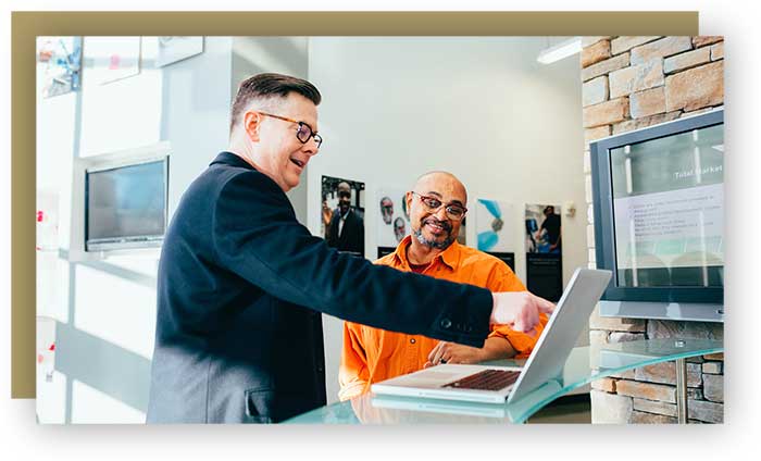 Two men discussing business in professional office